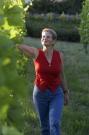 Haroula between vines in front of our winery